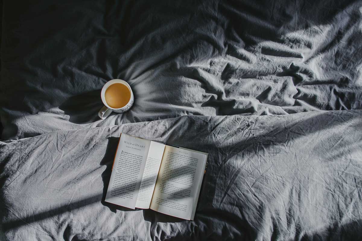 tea and book in bed